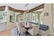 Kitchen breakfast nook with built-in bench seating and a view of the pool at 662 Fernwalk Ln, Osprey, FL 34229