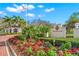 The Oaks Club entrance with landscaping at 662 Fernwalk Ln, Osprey, FL 34229