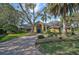 Beautiful 1-story home with a tile roof and lush landscaping at 662 Fernwalk Ln, Osprey, FL 34229