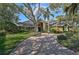 Two-story house with a brick driveway at 662 Fernwalk Ln, Osprey, FL 34229