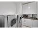 Laundry room with washer, dryer, and extra counter space at 662 Fernwalk Ln, Osprey, FL 34229