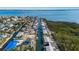 Aerial view of neighborhood, waterfront property and canal at 713 Saint Judes S Dr # 2, Longboat Key, FL 34228