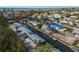 Aerial view of waterfront community with canal and homes at 713 Saint Judes S Dr # 2, Longboat Key, FL 34228