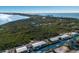 Aerial view of waterfront homes and canal at 713 Saint Judes S Dr # 2, Longboat Key, FL 34228