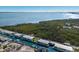 Aerial view of neighborhood, waterfront property and canal at 713 Saint Judes S Dr # 2, Longboat Key, FL 34228