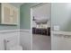 Clean bathroom with toilet and access to another room at 713 Saint Judes S Dr # 2, Longboat Key, FL 34228