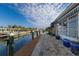 Private dock and canal access with a spacious brick paved patio at 713 Saint Judes S Dr # 2, Longboat Key, FL 34228