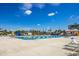 Relaxing community swimming pool with plenty of space for lounging at 713 Saint Judes S Dr # 2, Longboat Key, FL 34228