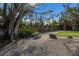 Park picnic table under large shade trees at 713 Saint Judes S Dr # 2, Longboat Key, FL 34228