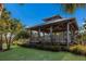 Wooden gazebo with walkway and lush greenery at 713 Saint Judes S Dr # 2, Longboat Key, FL 34228