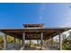 Wooden gazebo in park with tropical trees at 713 Saint Judes S Dr # 2, Longboat Key, FL 34228