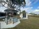 Quaint gazebo with shed and bird bath in the backyard at 7564 Joppa St, North Port, FL 34287