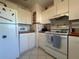 White kitchen with ample counter space and storage at 7564 Joppa St, North Port, FL 34287