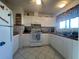 Bright kitchen with white cabinets and modern appliances at 7564 Joppa St, North Port, FL 34287