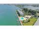 Aerial view of waterfront community with pool, boat slips, and lush grounds at 777 John Ringling Blvd # 2, Sarasota, FL 34236