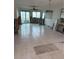 Living room with water damage and a hole in the floor, under renovation at 777 John Ringling Blvd # 2, Sarasota, FL 34236