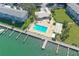 Resort-style pool with surrounding patio and lush landscaping at 777 John Ringling Blvd # 2, Sarasota, FL 34236