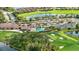 Community overview featuring clubhouse, pool, and tennis courts at 7803 Grand Estuary Trl # 102, Bradenton, FL 34212