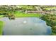 Golf course community with scenic lake and clubhouse at 7803 Grand Estuary Trl # 102, Bradenton, FL 34212