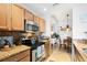 Well-equipped kitchen featuring granite countertops and ample cabinetry at 7803 Grand Estuary Trl # 102, Bradenton, FL 34212