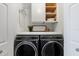 Laundry room with modern washer and dryer at 7803 Grand Estuary Trl # 102, Bradenton, FL 34212