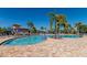 Resort-style pool with ample lounge chairs and umbrellas at 7803 Grand Estuary Trl # 102, Bradenton, FL 34212