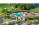 Resort-style pool and clubhouse near golf course at 7803 Grand Estuary Trl # 102, Bradenton, FL 34212