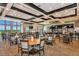 Spacious clubhouse restaurant with large windows and seating at 7803 Grand Estuary Trl # 102, Bradenton, FL 34212