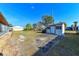 Large backyard with shed and grassy area at 817 Linnaen Nw Ter, Port Charlotte, FL 33948