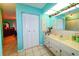 Bright bathroom with vanity and large mirror at 817 Linnaen Nw Ter, Port Charlotte, FL 33948