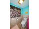 Bathroom with toilet and floral curtains at 817 Linnaen Nw Ter, Port Charlotte, FL 33948