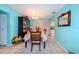 Bright dining room with a wood table and floral tablecloth at 817 Linnaen Nw Ter, Port Charlotte, FL 33948