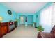 Bright living room with tile floors and a decorative fireplace at 817 Linnaen Nw Ter, Port Charlotte, FL 33948