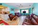 Relaxing living room with brown leather sectional sofa at 817 Linnaen Nw Ter, Port Charlotte, FL 33948