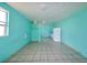 Bright studio with tile floors and a small kitchenette at 817 Linnaen Nw Ter, Port Charlotte, FL 33948