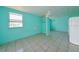 Studio features light teal walls and tile floors at 817 Linnaen Nw Ter, Port Charlotte, FL 33948