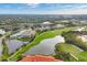 Aerial view of community, golf course and lake at 9630 Club South Cir # 6207, Sarasota, FL 34238