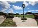 Landscaped area with clock and putting green at 9630 Club South Cir # 6207, Sarasota, FL 34238