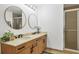 Bathroom with double vanity and a large walk-in shower at 1064 N Tamiami Trl # 1504, Sarasota, FL 34236