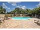 Inviting pool area with plenty of lounge chairs at 1064 N Tamiami Trl # 1504, Sarasota, FL 34236