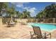 Relaxing pool area with lounge chairs and seating at 1064 N Tamiami Trl # 1504, Sarasota, FL 34236