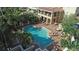 Aerial view of resort-style pool with surrounding patio at 1064 N Tamiami Trl # 1504, Sarasota, FL 34236