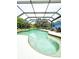 Inviting kidney-shaped pool with a large screened enclosure at 1109 Harbor Blvd, Port Charlotte, FL 33952