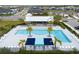 Community pool and surrounding area from above at 11771 Richmond Trl, Parrish, FL 34219