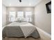 Spacious bedroom with king bed, soft textiles, and hardwood floors at 11771 Richmond Trl, Parrish, FL 34219