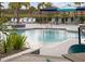 Inviting community pool area with shaded seating at 11771 Richmond Trl, Parrish, FL 34219