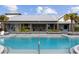 Relaxing community pool with plenty of lounge chairs at 11771 Richmond Trl, Parrish, FL 34219