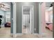 Hallway with light walls and doors to bedrooms and bath at 11771 Richmond Trl, Parrish, FL 34219