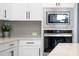 Built-in microwave and oven in a modern kitchen setting at 11771 Richmond Trl, Parrish, FL 34219