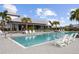 Community pool with plenty of seating and a cabana at 11771 Richmond Trl, Parrish, FL 34219